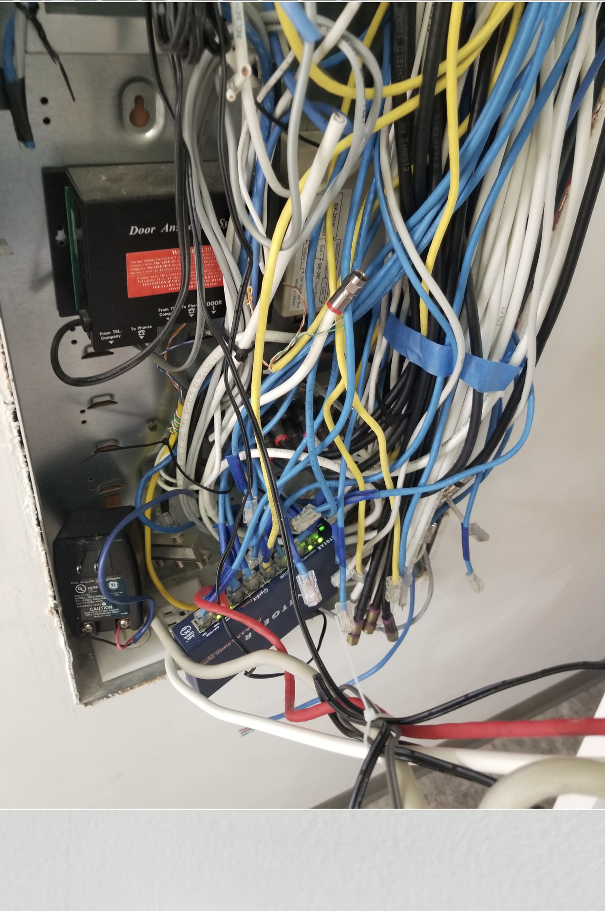 Messy wiring exposed outside of enclosure.